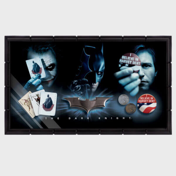 Batman The Dark Knight Prop Set display featuring Joker, Batman, Harvey Dent memorabilia and playing cards.