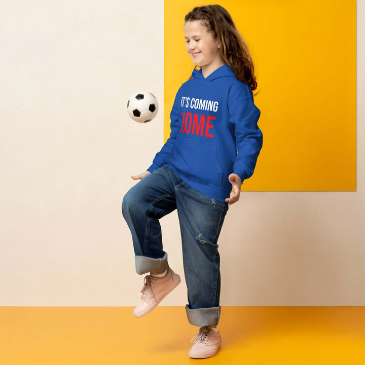 Child playing with a soccer ball wearing It&